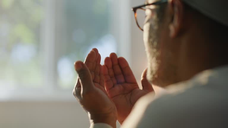 islamic-man-pray-and-hands-in-home-with-faith-peace-and-calm-with-worship-praise-and